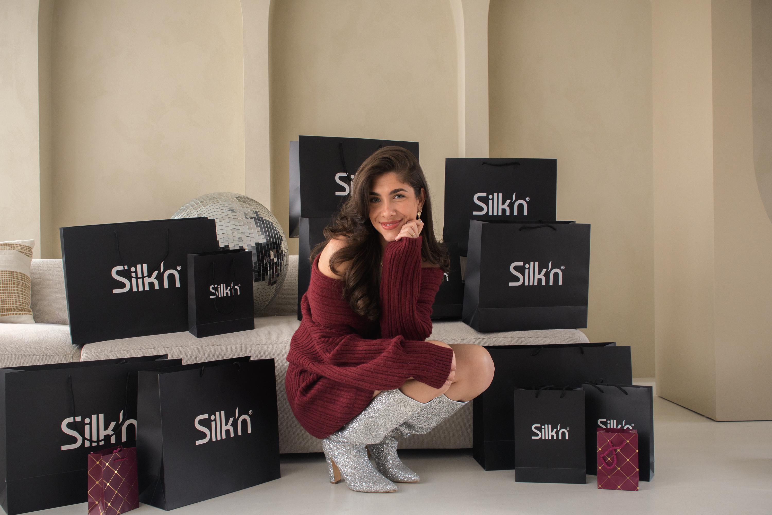 Woman with Christmas gifts Silk'n