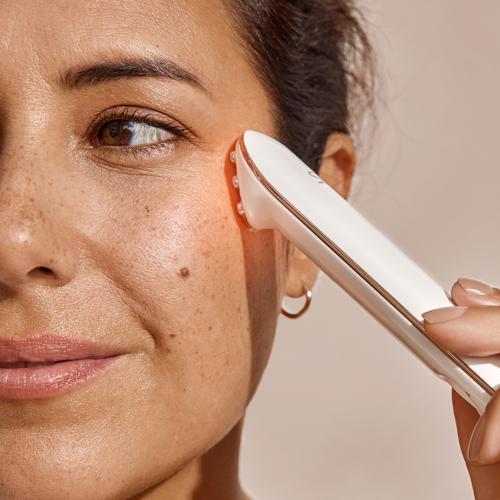 Using the Titan Mini skin tightening device on the fine lines around the eyes