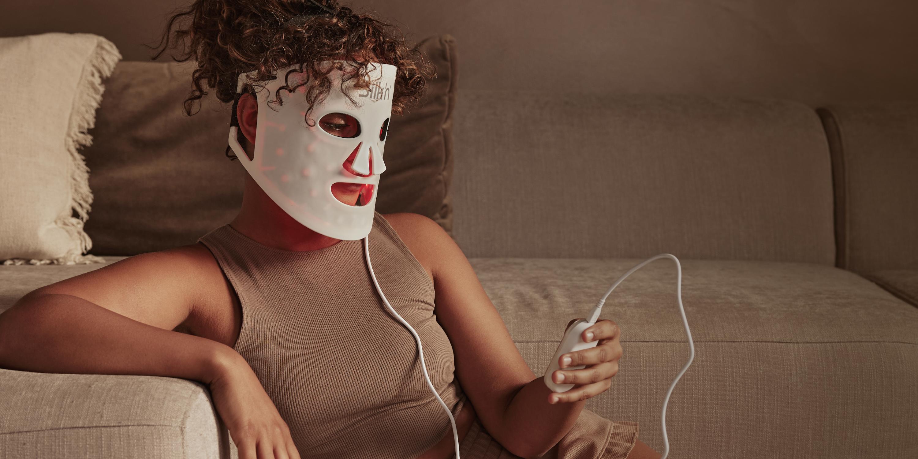 Woman wearing the Silk'n LED Face Mask 100