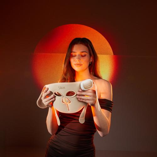 Woman watching her LED Face Mask Pro